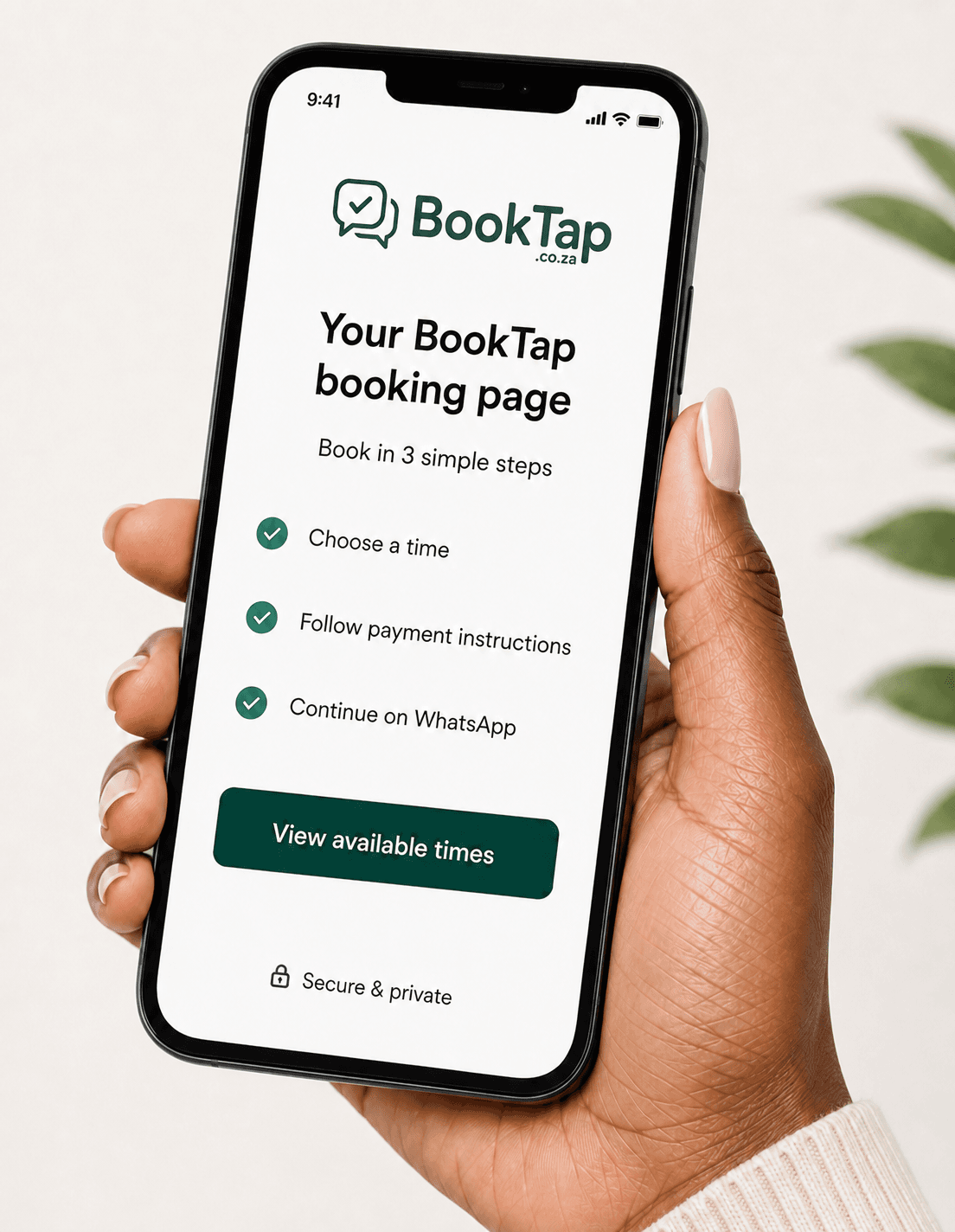 Hand holding a phone showing the BookTap booking page